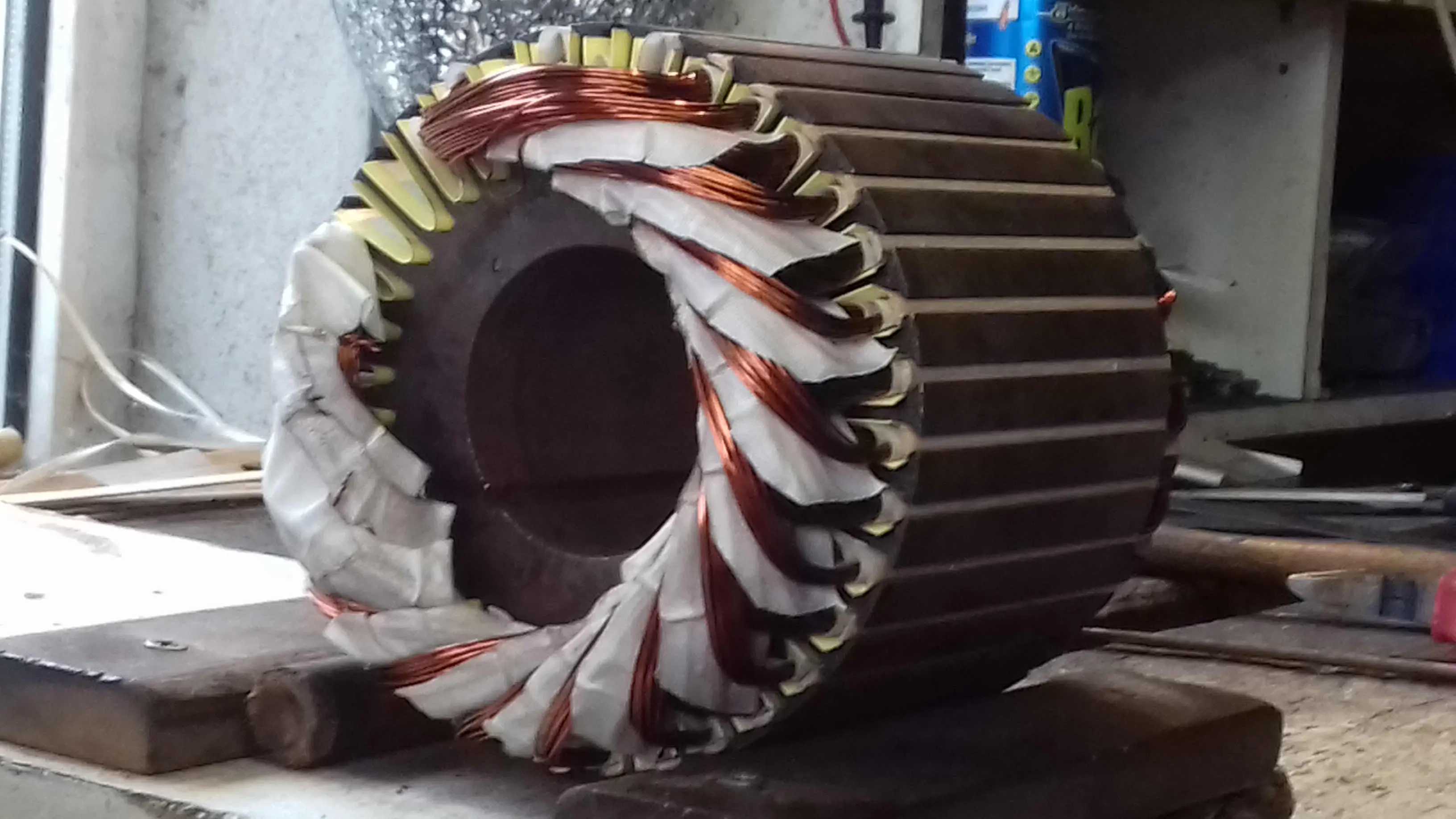 fan motor stator being rewound with new copper coils