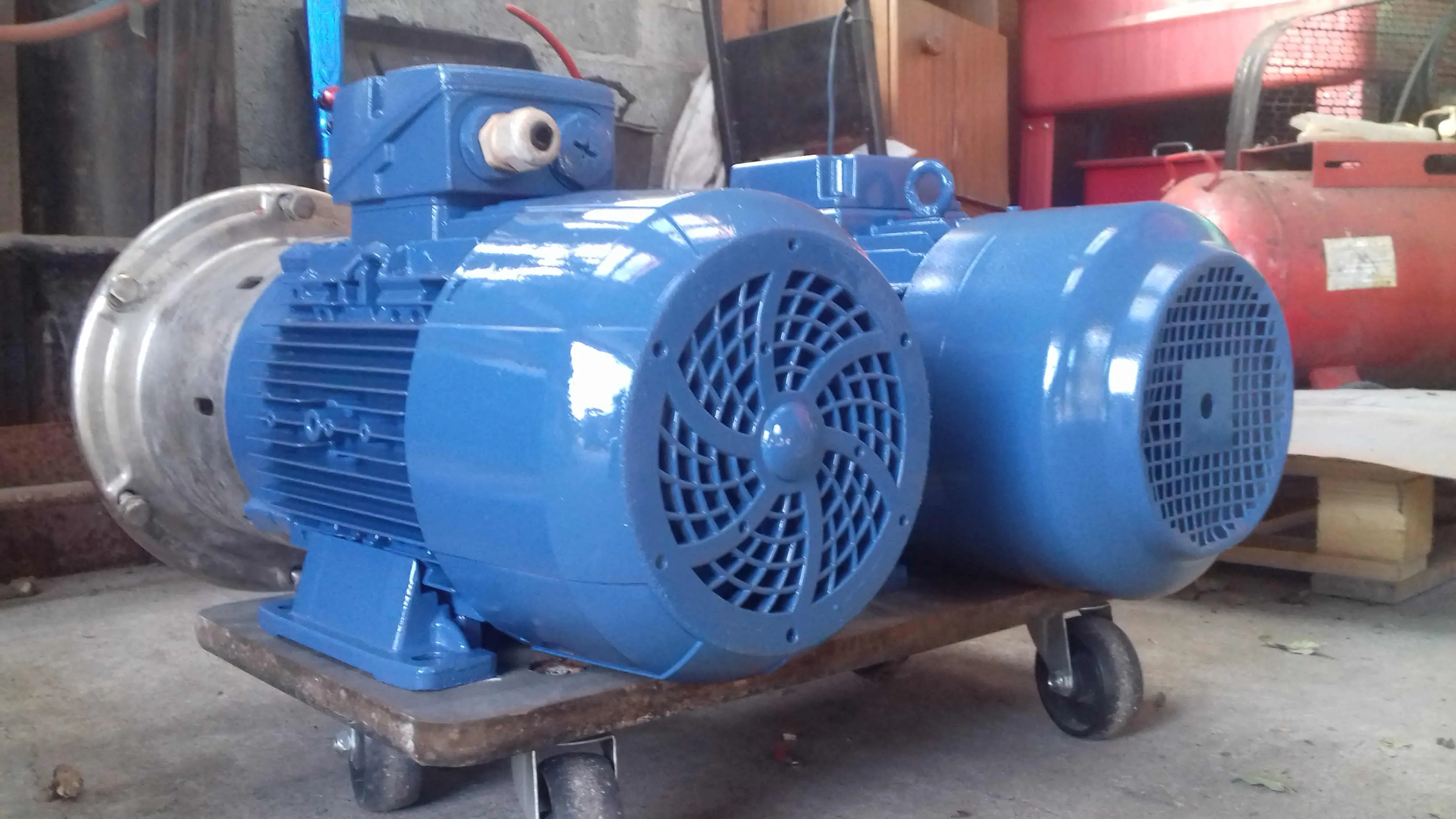 two blue pump motors rewound and spray painted